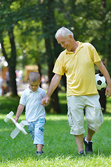 Image showing happy grandfather and child in park