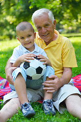 Image showing happy grandfather and child in park