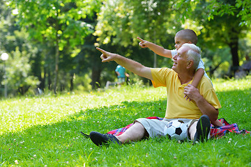 Image showing happy grandfather and child in park