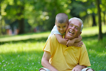 Image showing happy grandfather and child in park