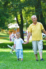 Image showing happy grandfather and child in park