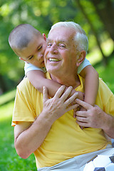 Image showing happy grandfather and child in park