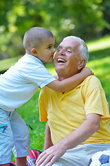 Image showing happy grandfather and child in park