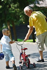 Image showing happy grandfather and child in park