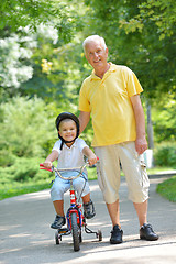 Image showing happy grandfather and child in park