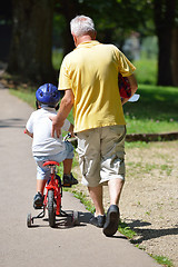 Image showing happy grandfather and child in park