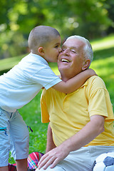 Image showing happy grandfather and child in park