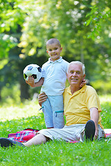 Image showing happy grandfather and child in park