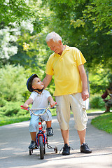 Image showing happy grandfather and child in park