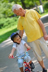 Image showing happy grandfather and child in park