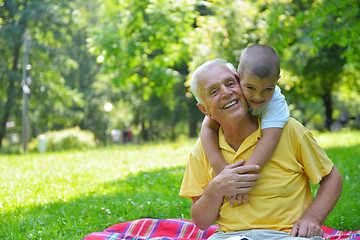 Image showing happy grandfather and child in park