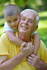 Image showing happy grandfather and child in park