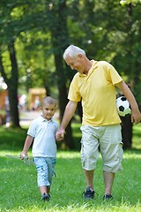 Image showing happy grandfather and child in park