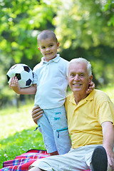 Image showing happy grandfather and child in park