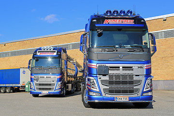 Image showing Two New Volvo FH Tanker Trucks by a Warehouse