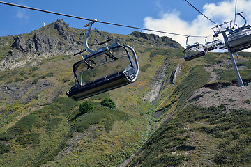 Image showing Row of the empty ski lift chairs