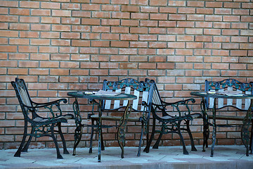 Image showing Beaten metal cafe tables and chairs