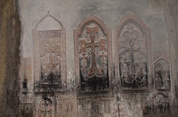 Image showing Several carved and painted crosses in rows