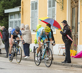 Image showing Two Cyclists Riding in the Rain