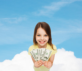 Image showing smiling little girl with dollar cash money