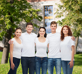 Image showing group of smiling teenagers in white blank t-shirts