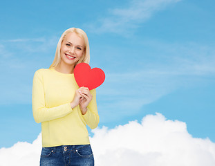 Image showing smiling woman with red heart