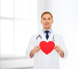 Image showing smiling male doctor with red heart and stethoscope