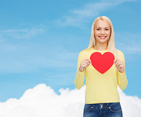 Image showing smiling woman with red heart