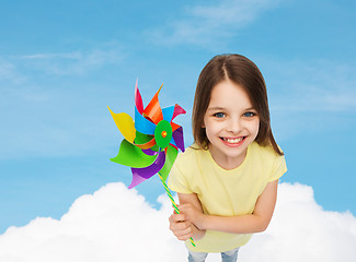 Image showing smiling child with colorful windmill toy