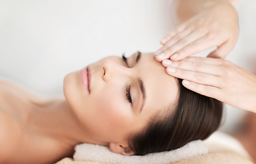 Image showing beautiful woman in spa salon having facial