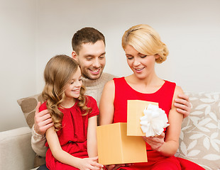 Image showing happy family opening gift box