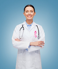 Image showing doctor with stethoscope, cancer awareness ribbon