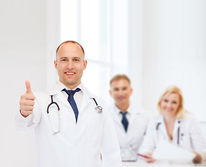 Image showing smiling male doctor with stethoscope