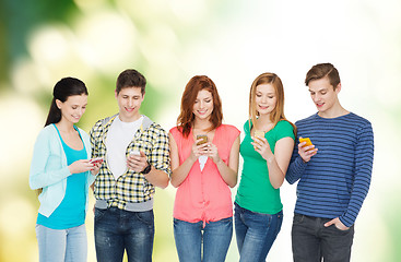 Image showing smiling students with smartphones