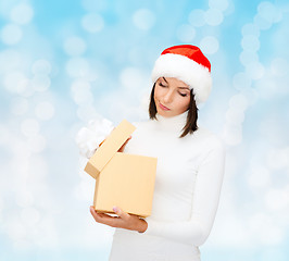 Image showing woman in santa helper hat with gift box