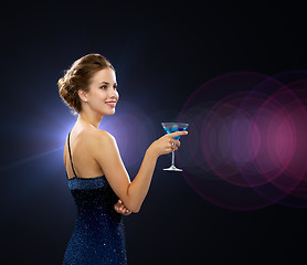 Image showing smiling woman holding cocktail