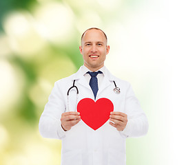 Image showing smiling male doctor with red heart and stethoscope