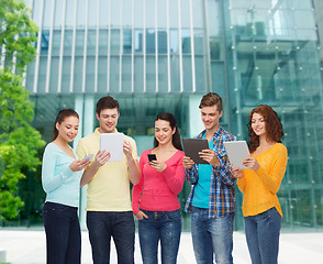 Image showing group of teenagers with smartphones and tablet pc