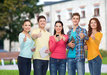 Image showing group of teenagers with smartphones and tablet pc