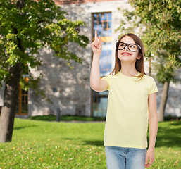 Image showing smiling cute little girl in black eyeglasses