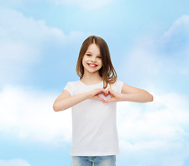 Image showing smiling little girl in white blank t-shirt