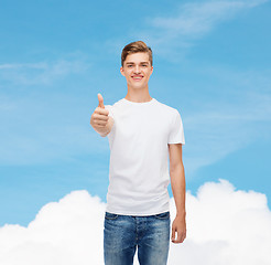 Image showing smiling man in white t-shirt showing thumbs up