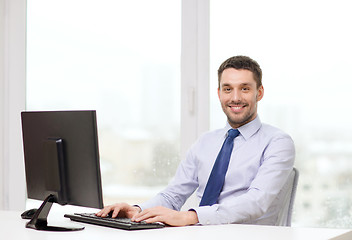 Image showing smiling businessman or student with computer