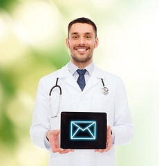 Image showing smiling male doctor with tablet pc