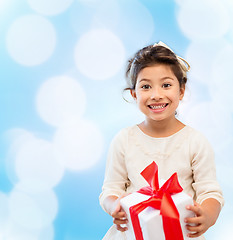 Image showing smiling little girl with gift box