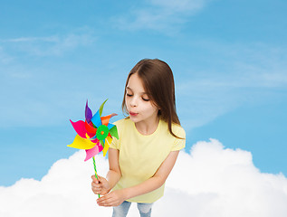 Image showing smiling child with colorful windmill toy