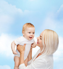 Image showing happy mother with smiling baby