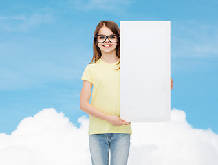 Image showing little girl wearing eyeglasses with blank board