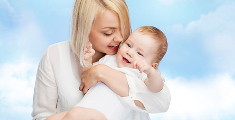 Image showing happy mother with smiling baby