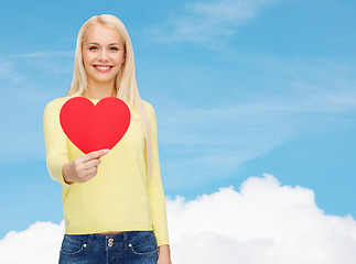 Image showing smiling woman with red heart